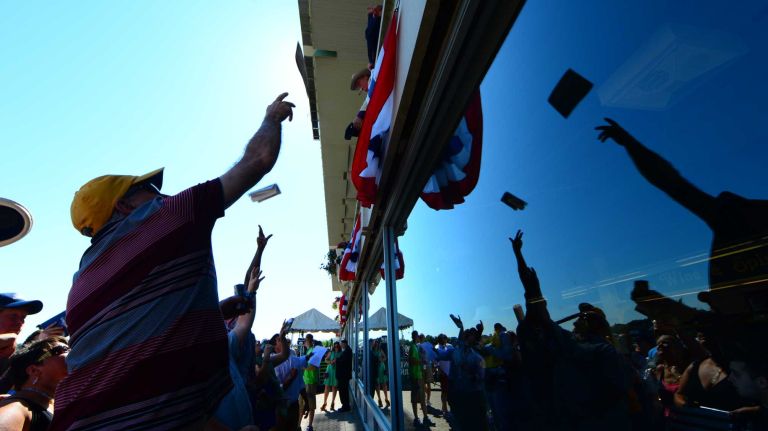 Horse racing enthusiasts try to get autographs from California Chrome's owner, Steve Coburn, at Belmont Park in Elmont on Saturday, June 7, 2014. The Belmont Stakes is the third and final leg of the triple crown of horse raising. This year's race marks the 146th running of the stakes where California Chrome will attempt to become racing's 12th Triple Crown winner.
