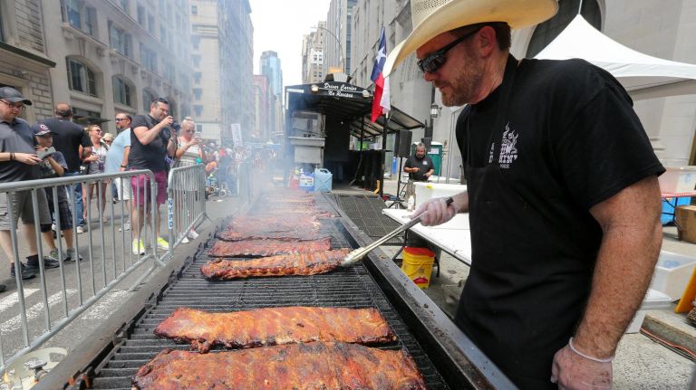 Mike Brixey, representing Dallas, Texas, works the grill for Baker's Ribs.