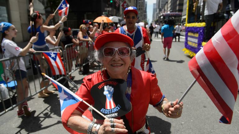 Participants march down Manhattan's Fifth Avenue during the 60th annual Puerto Rican Day Parade on Sunday, June 11, 2017.