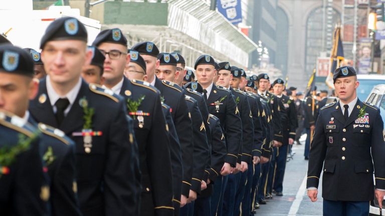 National Guard Infantry members of 1-69 Bravo Company lined up before the start of the St. Patrick's Day Parade on Saturday.