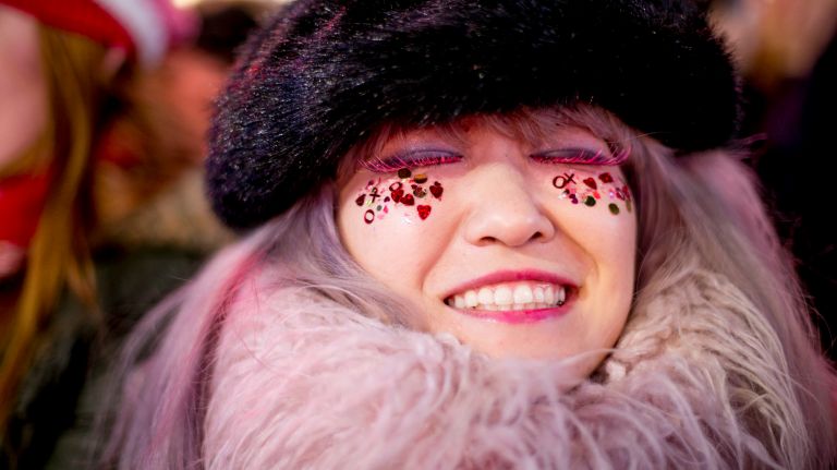 New Year's Eve Times Square ball drop: See photos 40 Mutsumi Suzuki, 21, of Japan, stands in the crowd in Times Square on New Year's Eve on Saturday, Dec. 31, 2016.