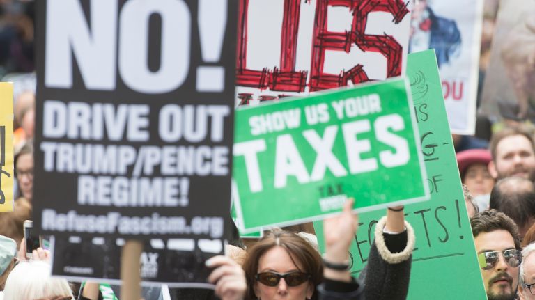 Protesters rally at Bryant Park during the Tax March on Saturday, April 15, 2017.