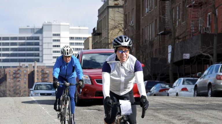 De Blasio: City to install 15 miles of bike lanes this year 1 Two female bicyclists are seen riding within the designated bike lane along W.218th Street in Upper Manhattan.