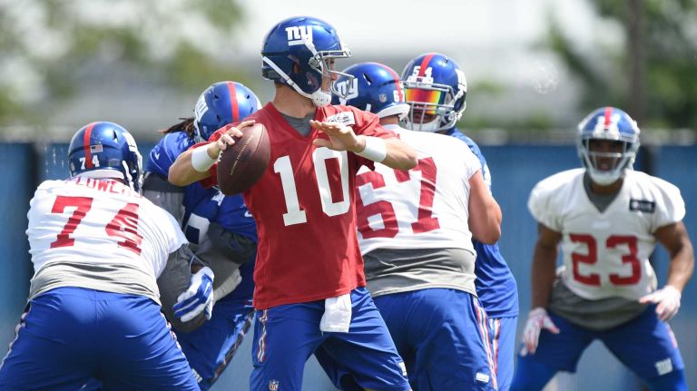 New York Giants quarterback Eli Manning looks to pass the football during the Giants Organized Team Activities at Quest Diagnostics Training Center on Wednesday, June 1, 2016.