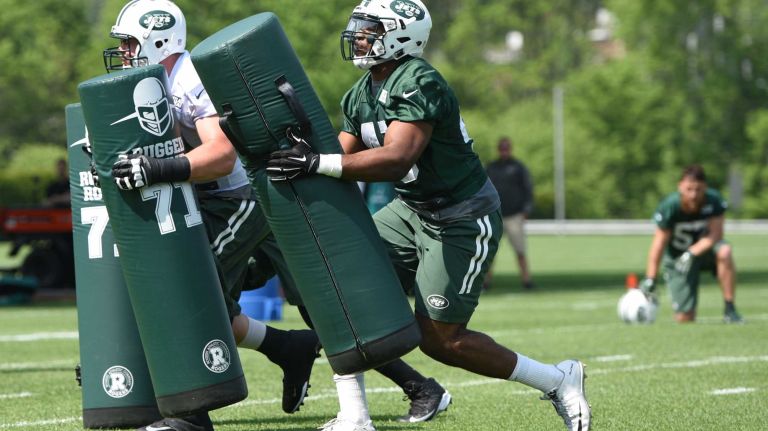 New York Jets linebacker Jordan Jenkins, right, and teammates run drills during Organized Team Activities at the Jets Training Center on Wednesday, May 25, 2016.