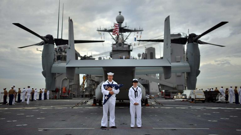 Fleet Week NYC: See photos of ships in New York Harbor and more 26 Seamen Ponce, left, and Gould hold an American flag on deck the USS Oak Hill during the Parade of Sails as their vessel moves on the Hudson River during the first day of Fleet Week on May 21 2014.