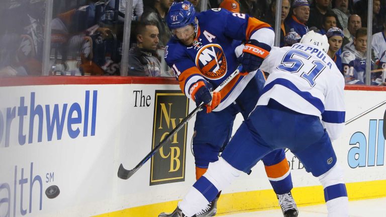 New York Islanders right wing Kyle Okposo (21) and Tampa Bay Lightning center Valtteri Filppula (51) battle on the boards in the second period in Game 3 of the Eastern Conference semifinals on Tuesday, May 3, 2016 at Barclays Center.