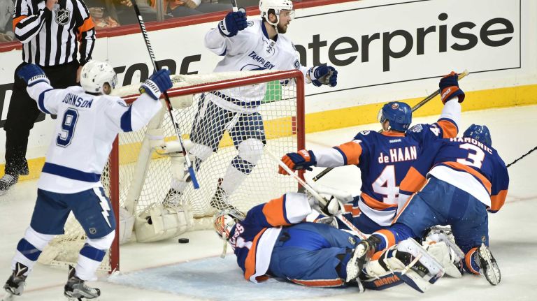 New York Islanders goalie Thomas Greiss (1) along with teammates Calvin de Haan (44) and Travis Hamonic (3) are all on the ice on the disallowed goal in the first period in Game 3 of the Eastern Conference semifinals on Tuesday, May 3, 2016 at Barclays Center.