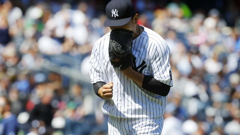 Yankees vs. Rays 72 Masahiro Tanaka #19 of the New York Yankees reacts after the fifth inning against the Tampa Bay Rays at Yankee Stadium on Saturday, April 23, 2016 in the Bronx Borough of New York City.