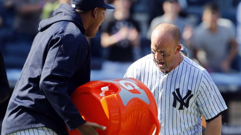 Yankees vs. Rays 76 Brett Gardner #11 of the New York Yankees celebrates his ninth inning game winning home run against the Tampa Bay Rays with teammate CC Sabathia #52 at Yankee Stadium on Saturday, April 23, 2016 in the Bronx Borough of New York City.
