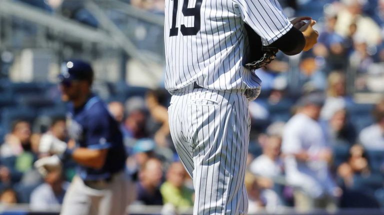 Yankees vs. Rays 97 Masahiro Tanaka #19 of the New York Yankees rubs up a new ball after surrendering a fifth inning home run against the Kevin Kiermaier #39 of the Tampa Bay Rays at Yankee Stadium on Saturday, April 23, 2016 in the Bronx Borough of New York City.