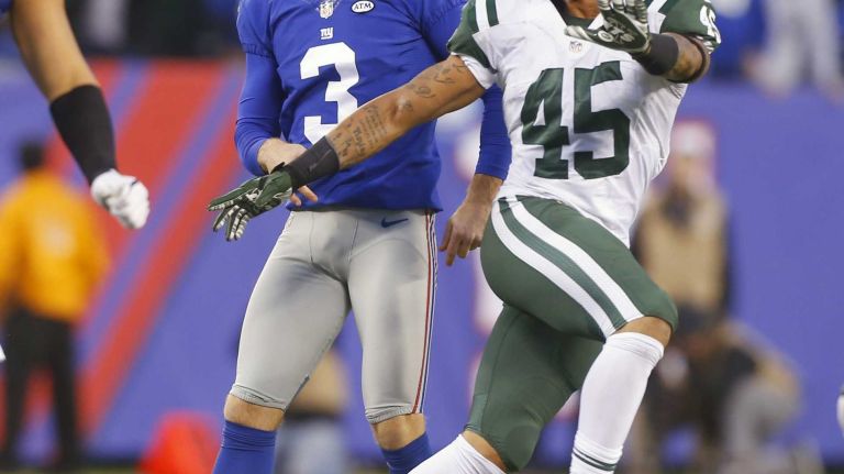 Josh Brown #3 of the New York Giants watches his missed field goal in overtime with Rontez Miles #45 of the New York Jets at MetLife Stadium on Sunday, Dec. 6, 2015 in East Rutherford, N.J.