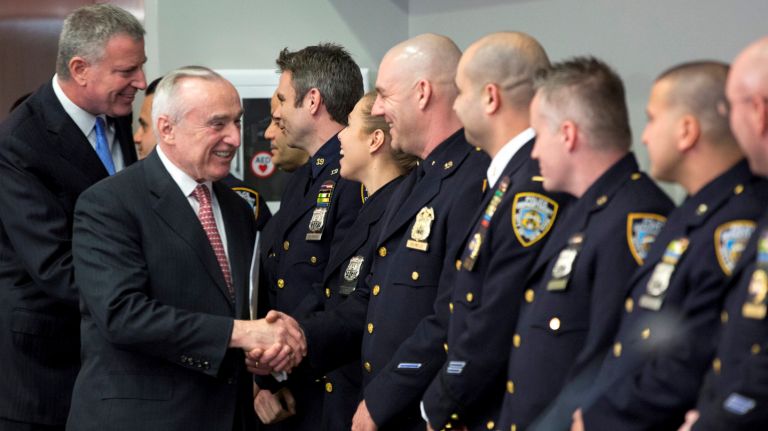 Officer’s racial concerns not a career booster 1 Mayor Bill de Blasio, left, and NYPD Commissioner William Bratton greet officers Tuesday, Feb. 23, 2016 at police headquarters. During a news conference, Bratton used an expletive to respond to a question about whether the NYPD uses a quota system for arrests and summonses.