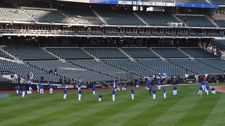 The New York Mets begin warmups before Game 3 of the World Series against the Kansas City Royals at Citi Field on Friday, Oct. 30, 2015.
