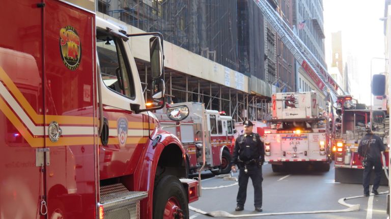 Authorities respond to the scene of a fatal building collapse at 25 W. 38th St.