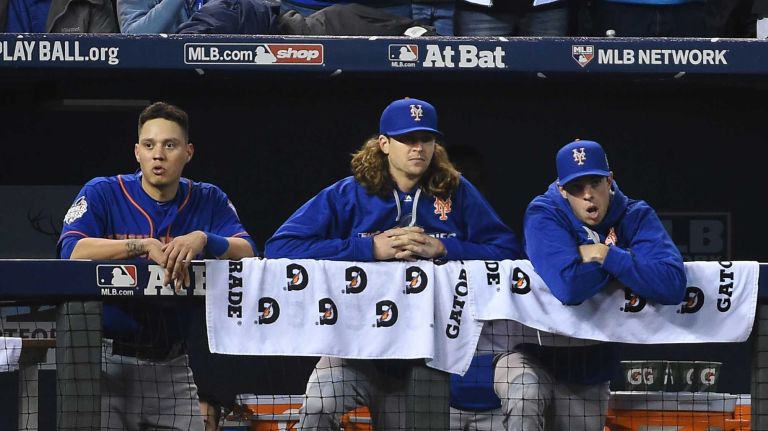 World Series Game 1: Mets vs. Royals 109 New York Mets shortstop Wilmer Flores (4) with New York Mets starting pitcher Jacob deGrom (48) and New York Mets starting pitcher Steven Matz (32) in the dugout during Game 1 of the World Series against the Kansas City Royals at Kauffman Stadium on Tuesday, Oct. 27, 2015.