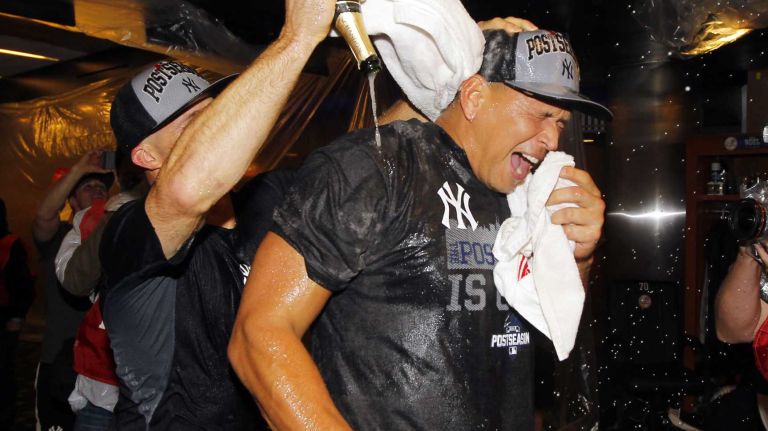 Alex Rodriguez of the New York Yankees celebrates in the locker room after defeating the Boston Red Sox at Yankee Stadium on Thursday, Oct. 1, 2015.