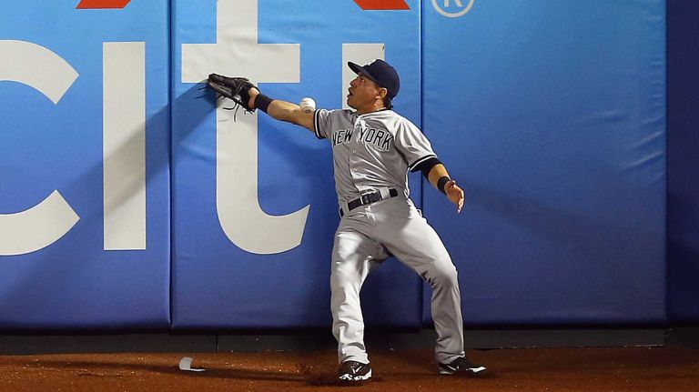 Subway Series: Yankees vs. Mets 74 Jacoby Ellsbury of the New York Yankees can't come up with a ball hit in the eighth inning for a triple by Daniel Murphy of the New York Mets at Citi Field on Friday, Sept. 18, 2015.
