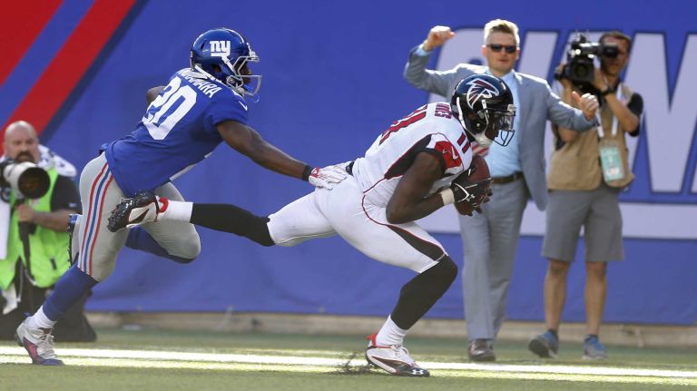 Julio Jones #11 of the Atlanta Falcons hauls in a reception at the 1 yard line late in the fourth quarter against Prince Amukamara #20 of the New York Giants at MetLife Stadium on Sunday, Sept. 20, 2015.