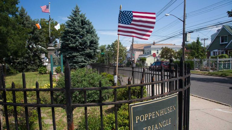 College Point, Queens 22 Poppenhusen Triangle College Point Blvd. and College Pl. a bust of Conrad Poppenhusen is protected by a water line fence. City Living in the neighborhood of College Point in Queens.August 7, 2015