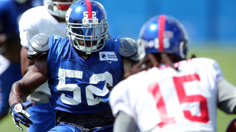 New York Giants linebacker Jon Beason lines up a play on wide receiver Preston Parker during training camp at the Quest Diagnostics Training Center in East Rutherford, N.J., on Sunday, Aug. 2, 2015.