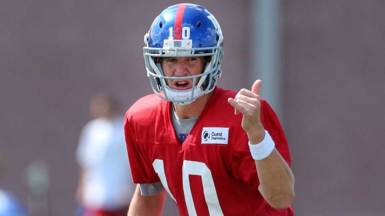 New York Giants quarterback Eli Manning calls a play at the line during training camp at the Quest Diagnostics Training Center in East Rutherford, N.J., on Saturday, Aug. 1, 2015.