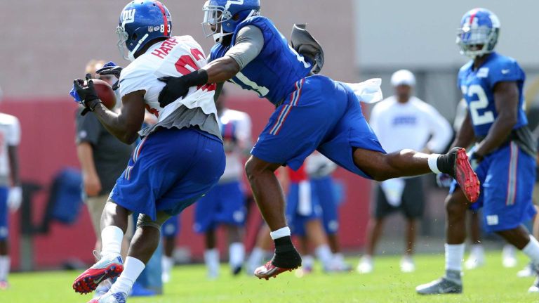 New York Giants safety Landon Collins breaks up a pass intended for wide receiver Chris Harper during training camp at the Quest Diagnostics Training Center in East Rutherford, N.J., on Saturday, Aug. 1, 2015.