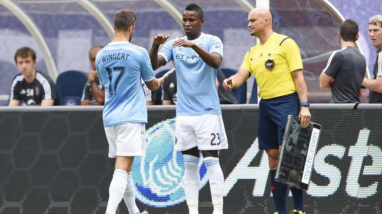 New York City FC defender Chris Wingert (17) is taken out early after sustaining an injury and replaced by teammate midfielder Matt Dunn (23) in an MLS game against the Orlando City FC at Yankee Stadium on Sunday, July 26, 2015.