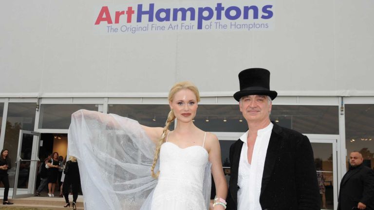 Kristin Mackie and artist Kevin Berlin arrive at the opening Thursday, July 2, 2015, of ArtHamptons in Bridgehampton.