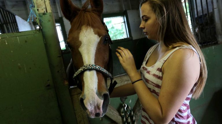 Jordyn Krute, 16, with her horse, Nonni, at the Seguine Equestrian Center, in Prince's Bay, Staten Island, Friday, May 22, 2015.