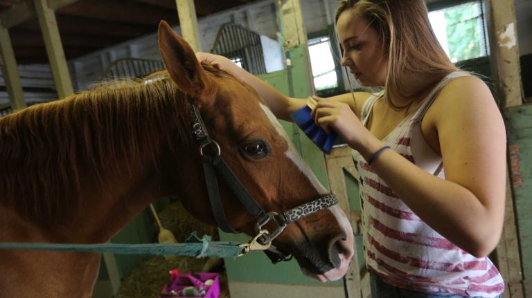 Jordyn Krute, 16, with her horse, Nonni, at the Seguine Equestrian Center, in Prince's Bay, Staten Island, Friday, May 22, 2015.