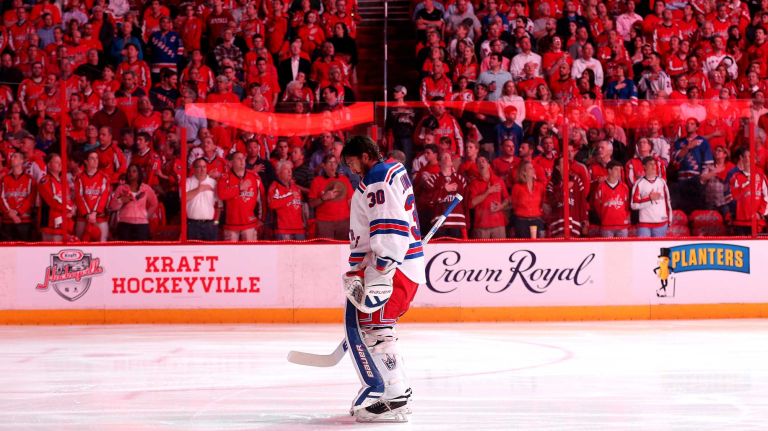 Goalie Henrik Lundqvist #30 of the New York Rangers looks on during the national anthem before playing the Washington Capitals in Game 3 of the Eastern Conference semifinals during the 2015 NHL Stanley Cup playoffs at Verizon Center on May 4, 2015.