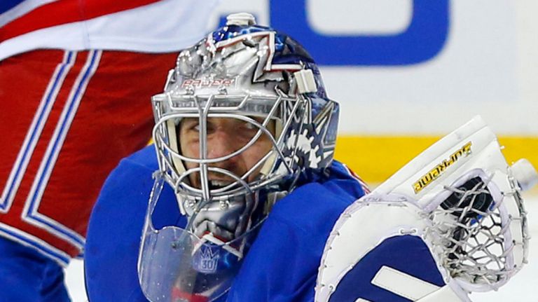 Henrik Lundqvist of the New York Rangers makes a glove save in the second period against the Edmonton Oilers at Madison Square Garden on Tuesday, Dec. 15, 2015 in New York City.