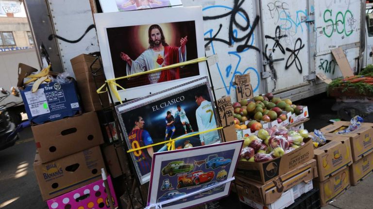 City Living: North Corona 57 Artwork along with fruit sold along Roosevelt ave. in North Corona, Queens, Tuesday, April 21, 2015.