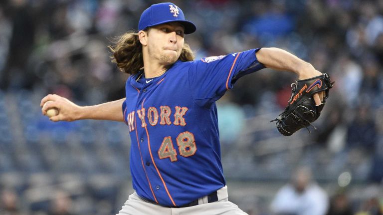 New York Mets starting pitcher Jacob deGrom delivers in the first inning against the New York Yankees in a baseball game at Yankee Stadium on Friday, April 24, 2015.