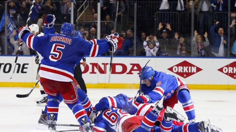 The New York Rangers celebrate their overtime goal against the Pittsburgh Penguins during Game 5 of the Eastern Conference Quarterfinals scored by Carl Hagelin at Madison Square Garden on Friday, April 24, 2015.