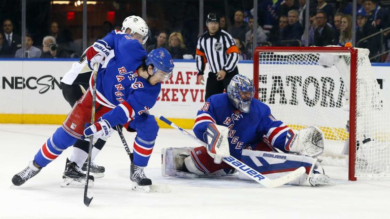 Henrik Lundqvist of the New York Rangers defends the net in the third period against the Pittsburgh Penguins during Game 5 of the Eastern Conference Quarterfinals at Madison Square Garden on Friday, April 24, 2015.
