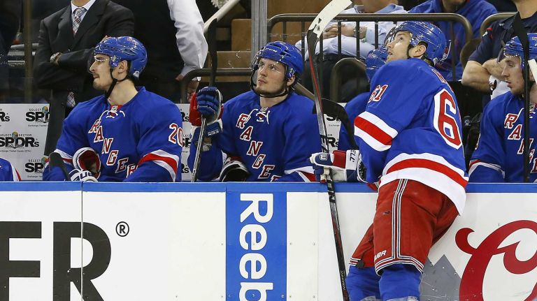 Chris Kreider, J.T. Miller and Rick Nash of the New York Rangers look on at the bench in the second period against the Pittsburgh Penguins during Game 5 of the Eastern Conference Quarterfinals at Madison Square Garden on Friday, April 24, 2015.