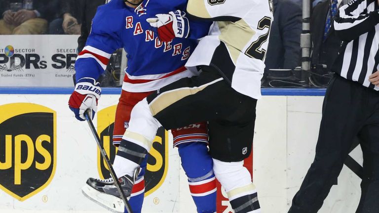 Chris Kreider of the New York Rangers checks Ian Cole of the Pittsburgh Penguins in the first period during Game 5 of the Eastern Conference Quarterfinals at Madison Square Garden on Friday, April 24, 2015.