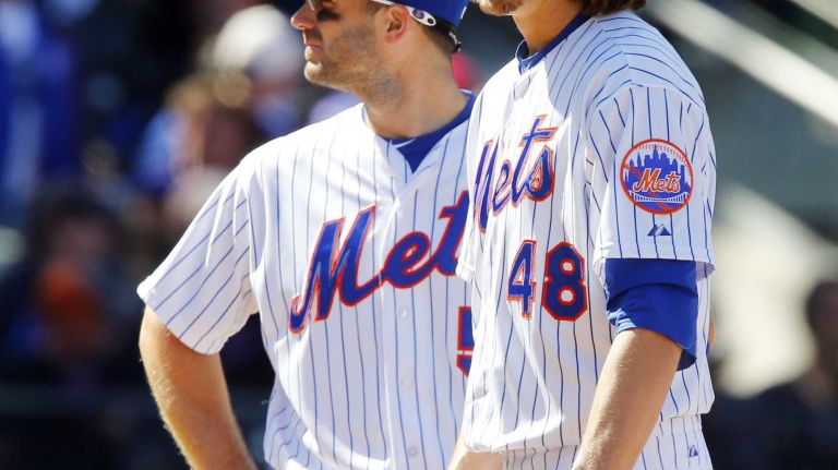Jacob deGrom #48 of the New York Mets stands on the mound with teammate David Wright #5 in the seventh inning before leaving a game against the Philadelphia Phillies during Opening Day at Citi Field on Monday, Apr. 13, 2015 in the Queens Borough of New York City.