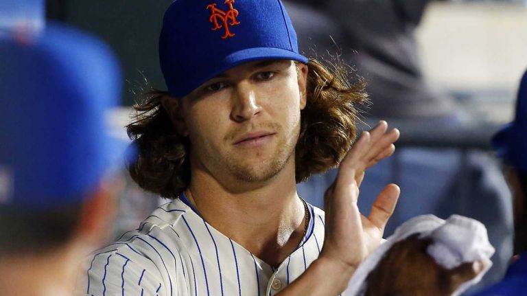 Jacob deGrom of the Mets in the dugout after leaving a game in the eighth inning against the San Francisco Giants at Citi Field on Saturday, Aug. 2, 2014.