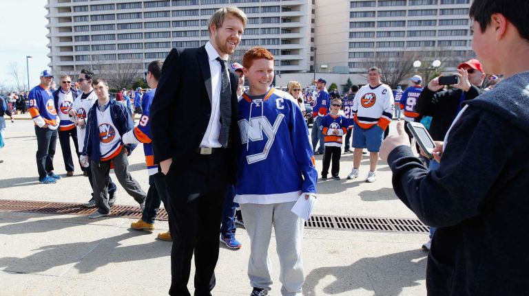 Griffin Reinhart #8 of the New York Islanders arrives for Game 3 of the Eastern Conference quarterfinals against the Washington Capitals during the 2015 NHL Stanley Cup Playoffs at the Nassau Veterans Memorial Coliseum on April 19, 2015.