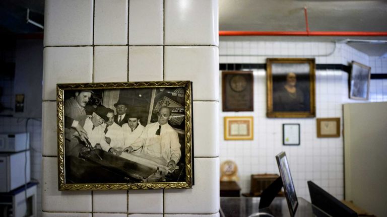 Family paintings, photographs and remembrances are seen at the storefront shop at the Streit's Matzo Factory on Rivington Steet in Manhattan on Monday, March 9, 2015. The factory, a long-established part of the Lower East Side since 1925, is planning to leave the spot by this summer.