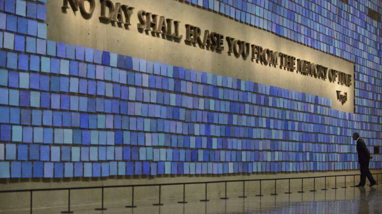 President Barack Obama walks through Memorial Hall at the National September 11 Memorial Museum at the World Trade Center site in Manhattan, Thursday, May 15, 2014. 