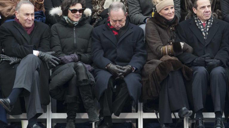 From left seated in the front row: Sen. Charles Schumer, Diana Taylor, former Mayor Michael Bloomberg, Sandra Lee, and Gov. Andrew M. Cuomo on the dais before former President Bill Clinton administers the oath of office to new Mayor Bill de Blasio outside of City Hall in Manhattan on Wednesday, Jan. 1, 2014. De Blasio, the city's first Democratic mayor in two decades, has promised a new era of progressive leadership.