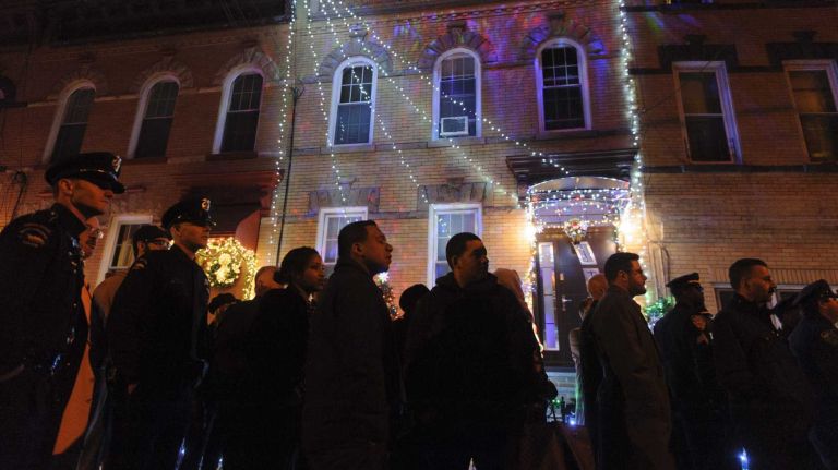 Rafael Ramos, slain NYPD officer, remembered at Queens wake 25 Thousands of people stood in line to pay their respects to NYPD Officer Rafael Ramos during his wake at Christ Tabernacle Church in Queens on Friday, Dec. 26, 2014.