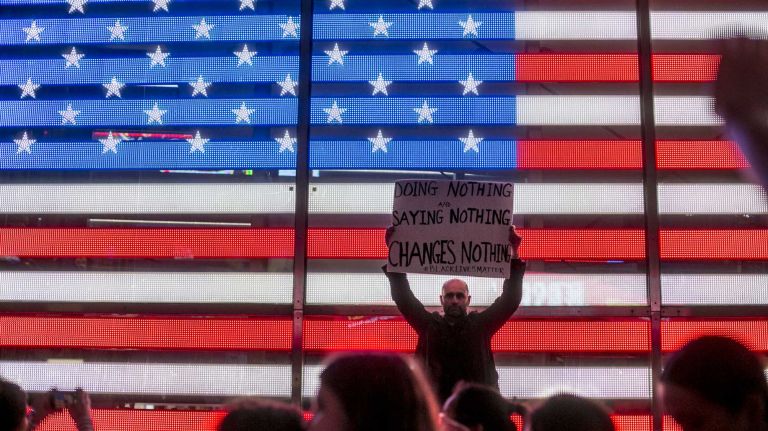 Protesters react in Times Square Monday, Nov. 24, 2014, after a grand jury decision declined to indict Ferguson, Mo., police Officer Darren Wilson who shot and killed an unarmed Michael Brown in August.