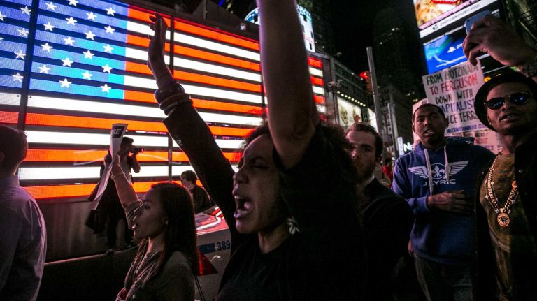 Protesters in Times Square respond to the news on Monday, Nov. 24, 2014, that a grand jury has declined to indict Ferguson, Mo., police Officer Darren Wilson who shot and killed an unarmed Michael Brown in August.