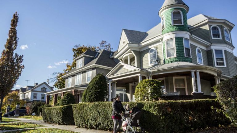Flatbush photos 13 A woman Walks along Beverly Road in Flatbush in Brooklyn on November 14, 2014.