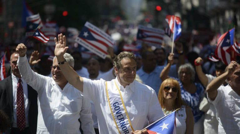 Gov. Andrew M. Cuomo marches in the 57th annual National Puerto Rican Day Parade in Manhattan on Sunday, June 8, 2014.